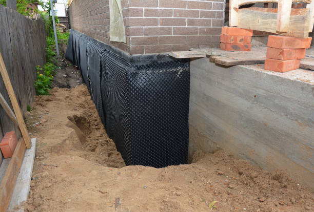 Happy homeowners after waterproofing job in La Salle